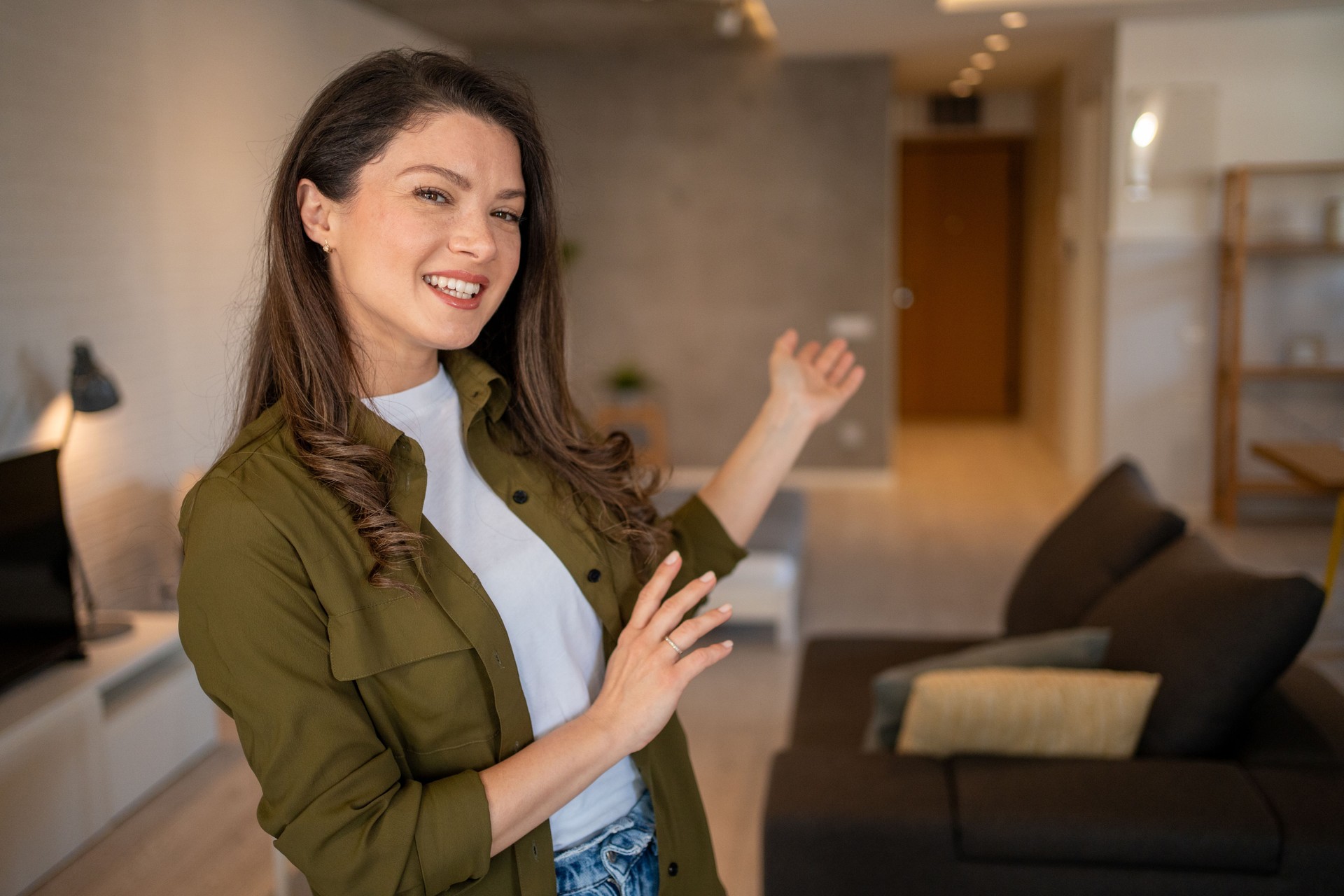 Real estate agent showing modern apartment to potential buyers